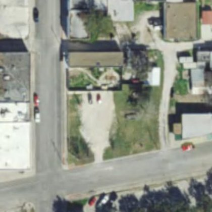 Aerial view, January 2016 — first plantings and soil work visible on the lot