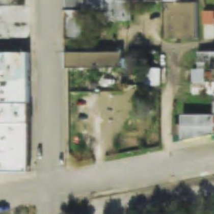 Aerial view, 2018 — green establishing across the lot, the bare patch shrinking